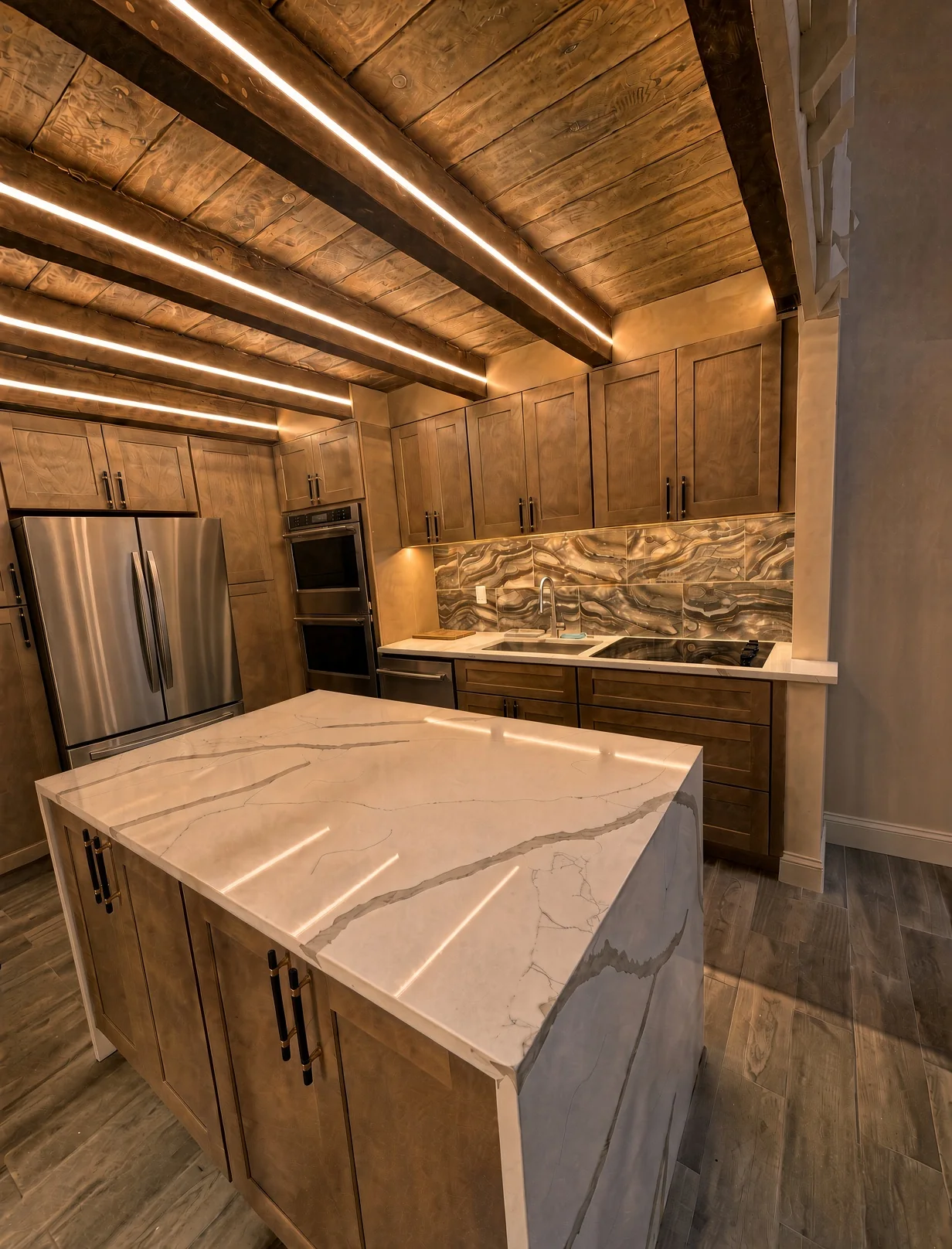 Kitchen with an LED-lit wood beam ceiling, wood cabinetry and a waterfall quartz island