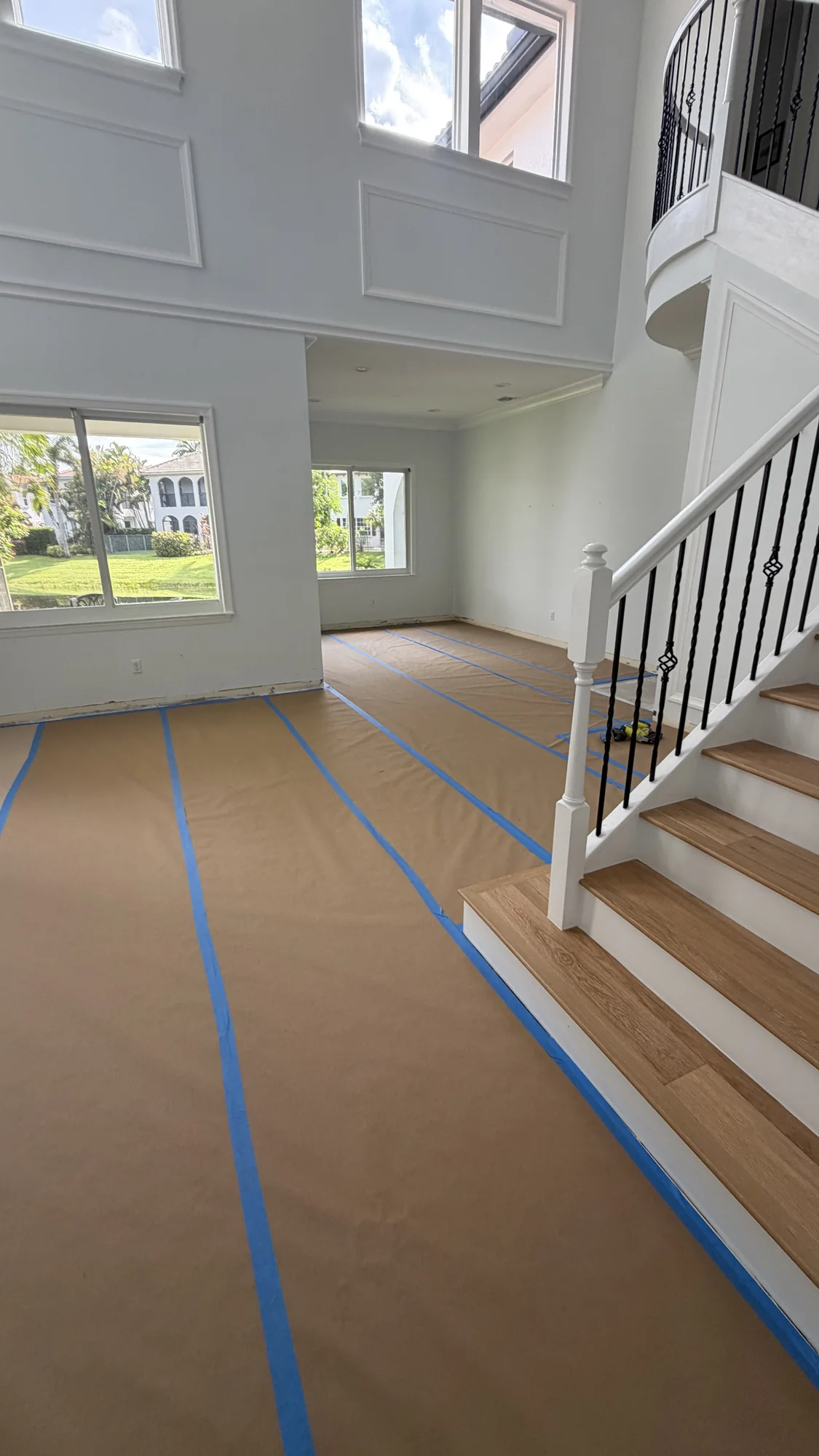 Floors and staircase covered with protection paper during renovation